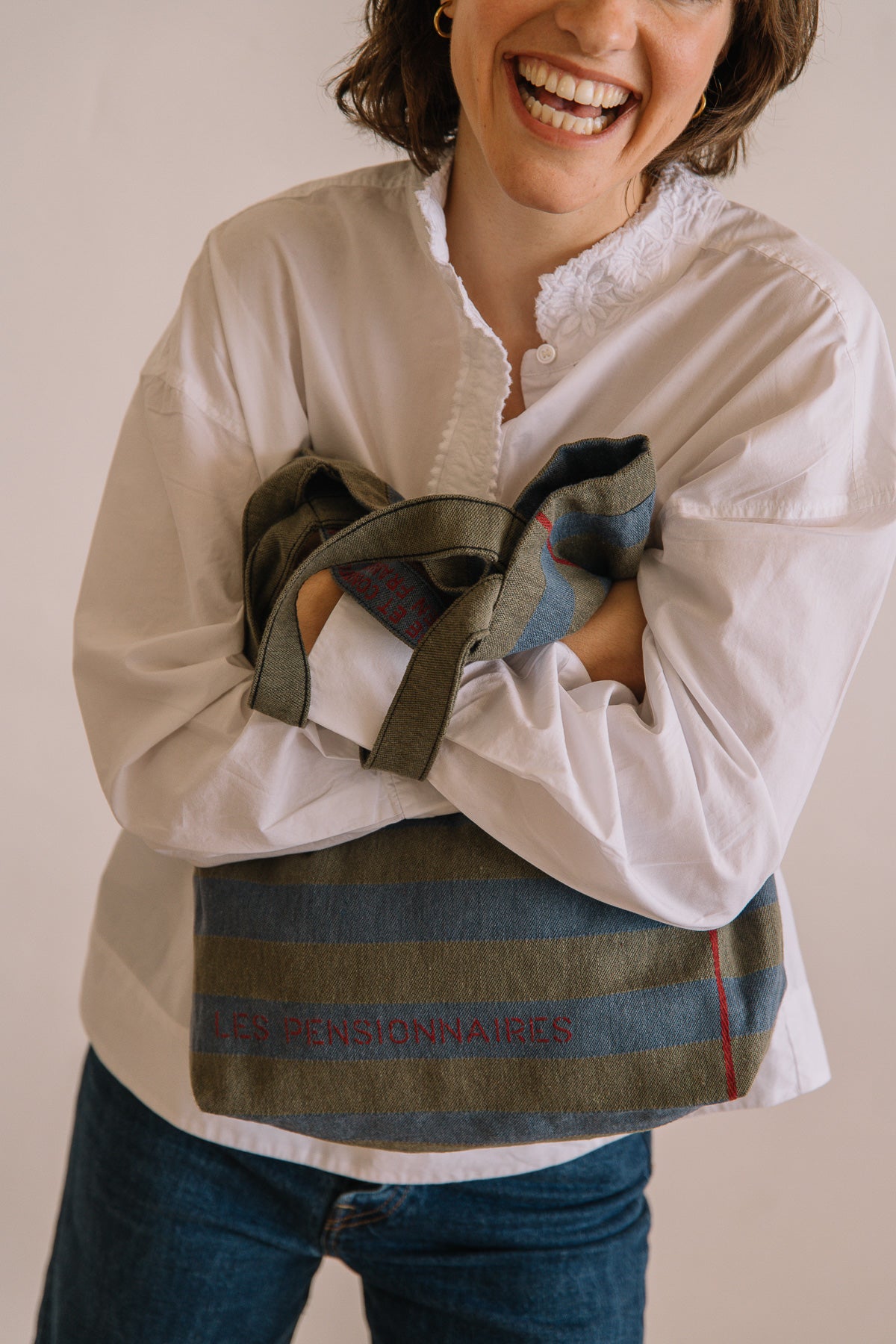 Green and blue striped tote bag made from recycled fibers