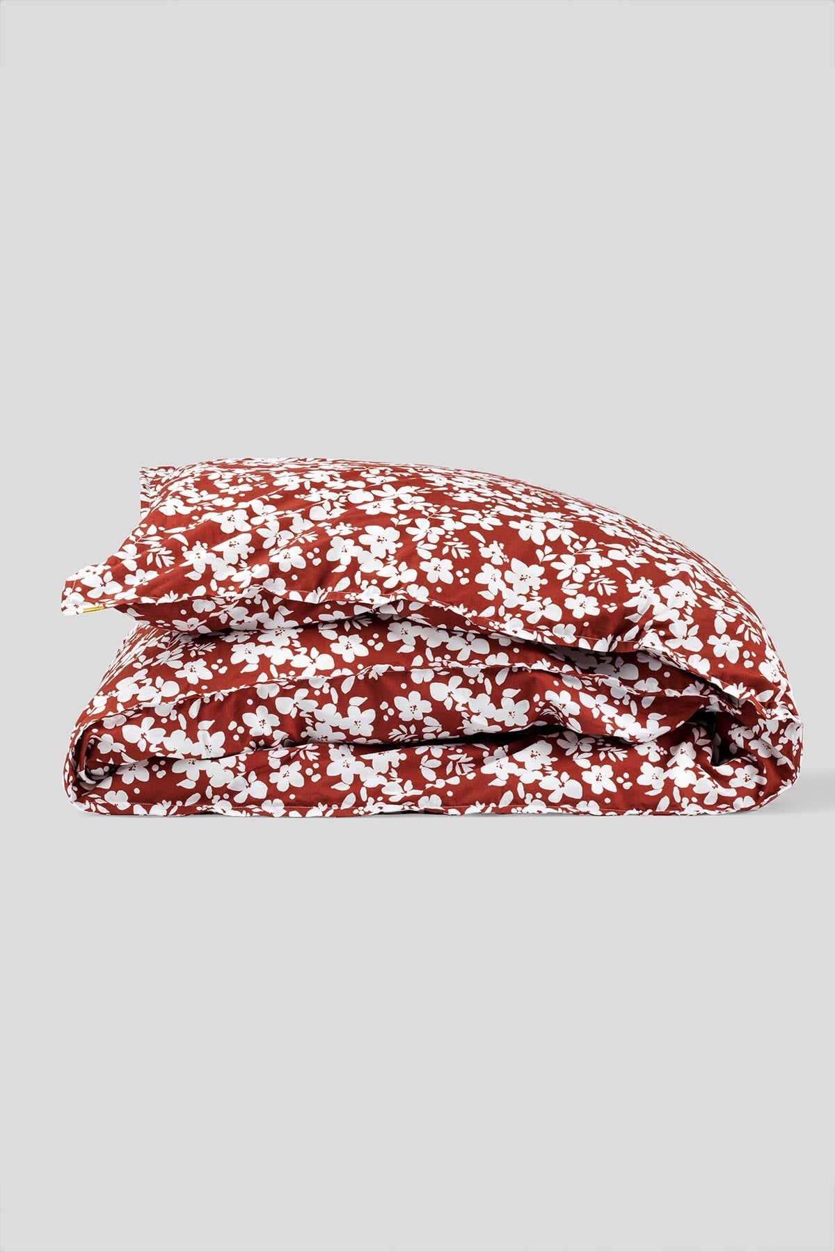 Housse de couette en percale de coton bio rouille ravissant semis de fleurs blanches